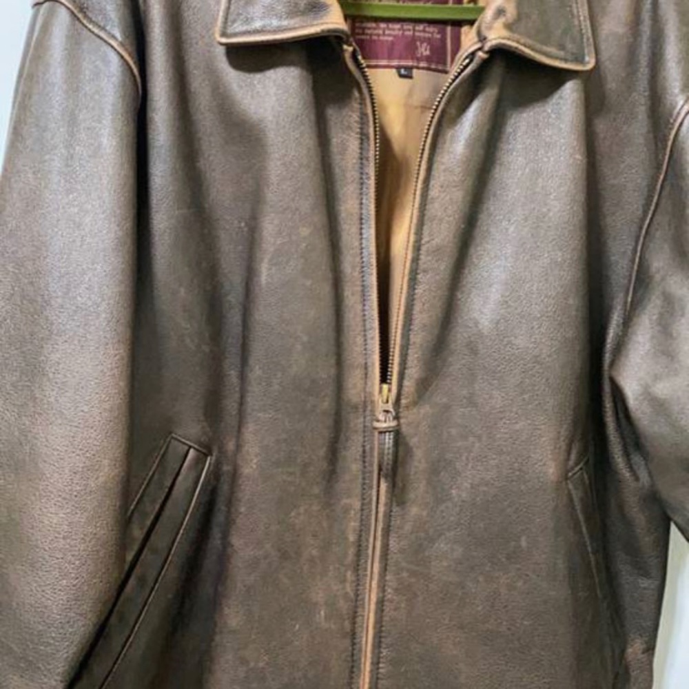 Real heavy leather very nice color and very good condition size l
